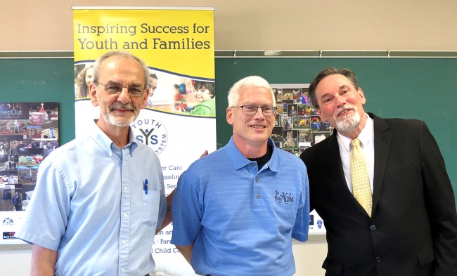 YSS CEO John Moses, Ye Olde Alpha chef/owner Charlie Schlegel and YSS board member Robert Gaudio are shown at the YSS press conference announcing Schlegel as the 2019 Youth Services System Good Samaritan.